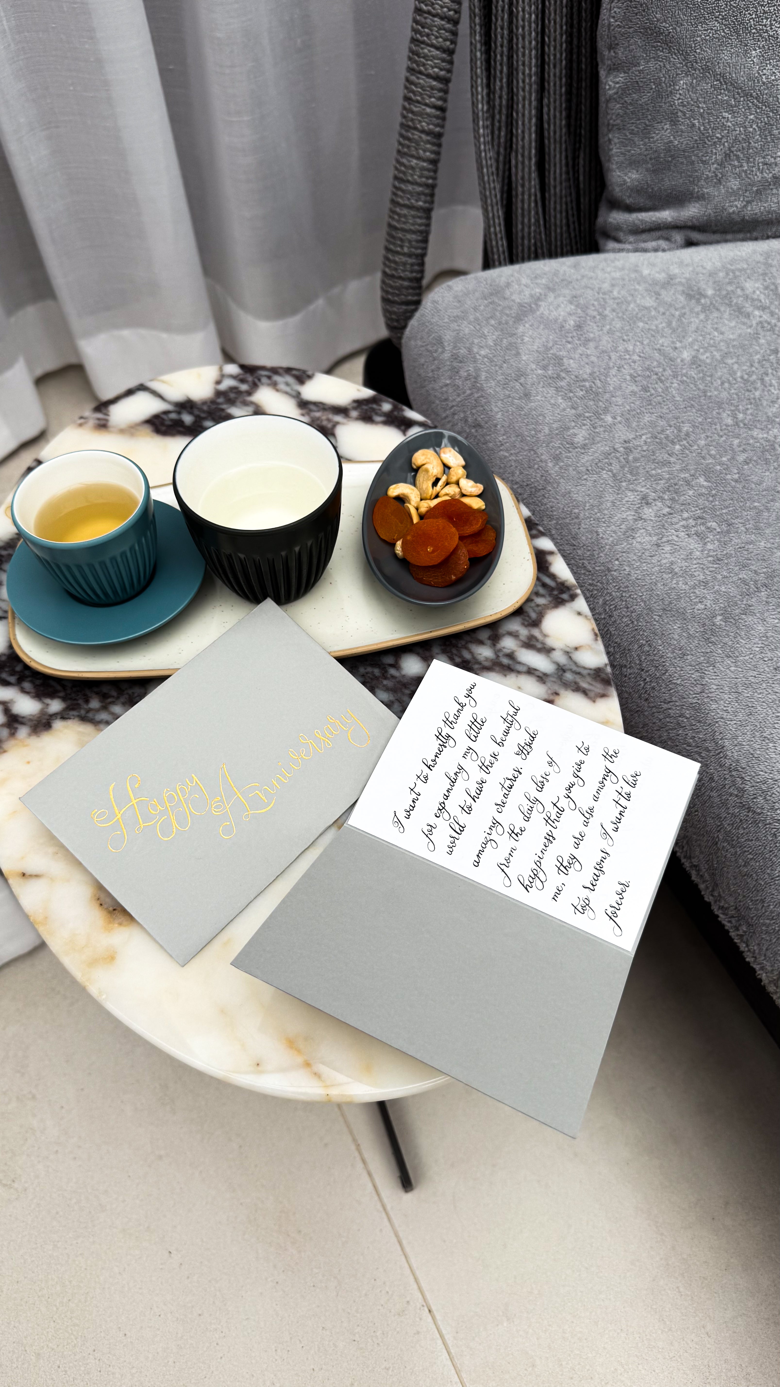 Story of  Elegance Diver Grey Anniversary card at a spa.