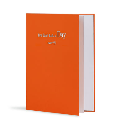 You Dont Look A Day Over 21 Greeting Card in Orange, Side
